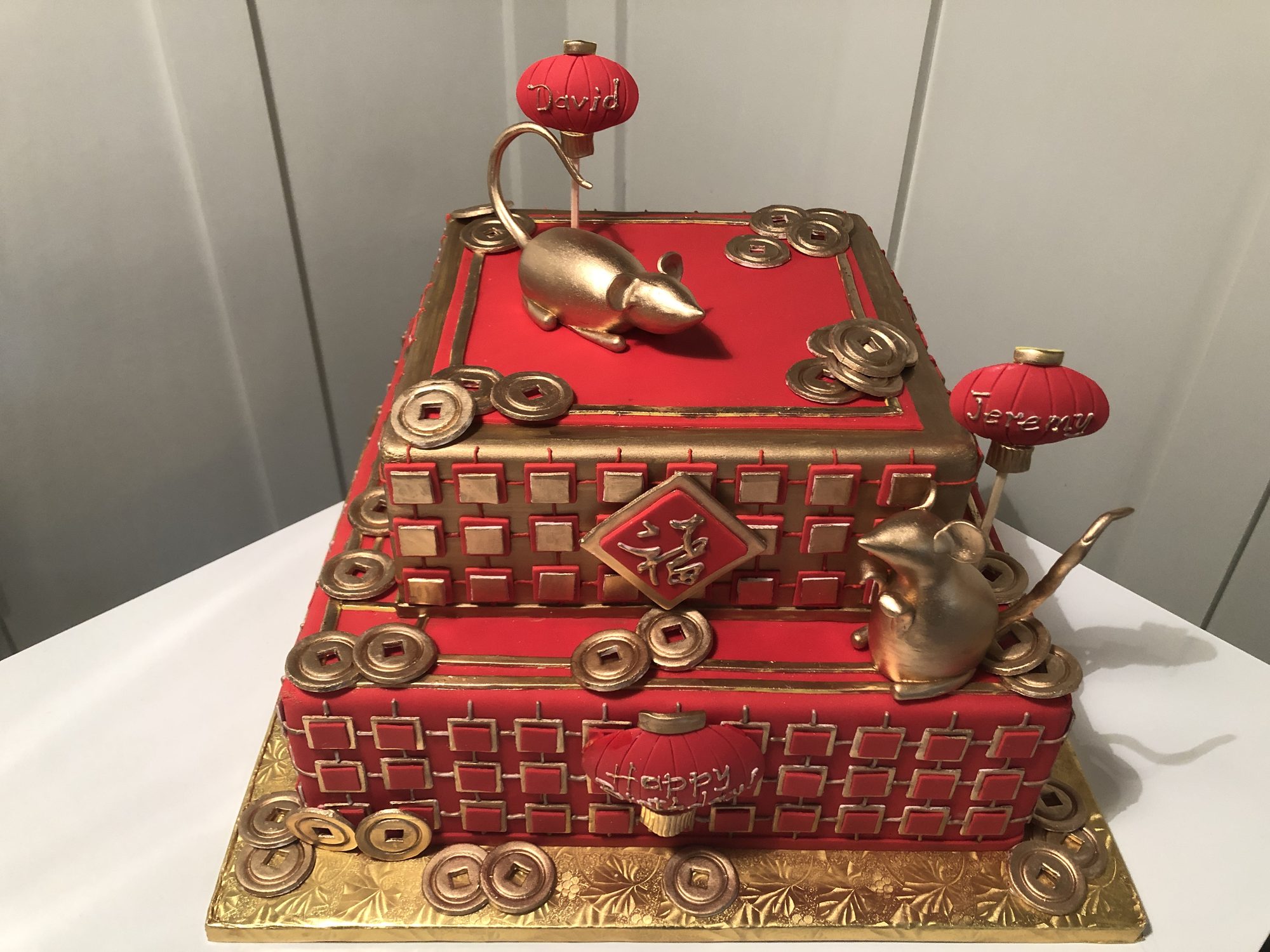 Chinese New Year cake with sugar rats and gold coins